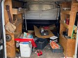 a van that has a lot of stuff inside of it