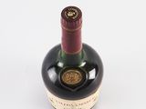 a bottle of wine that is sitting on a table