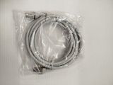 a cable that is wrapped in plastic on a white surface