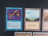 four cards that are sitting on a table