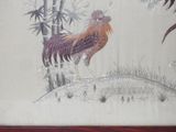 a picture of a painting of a rooster on the wall