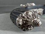 a silver object that is sitting on a table