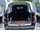 a white van with its doors open in a parking lot
