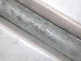 a close up of a metal pipe on the ground