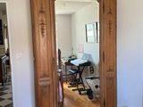 a large mirror in the corner of a room