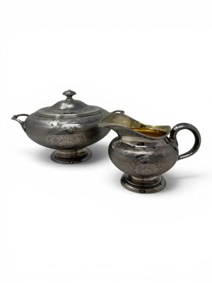 a pair of silverplated sugar and creamers