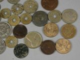a lot of coins that are on the table