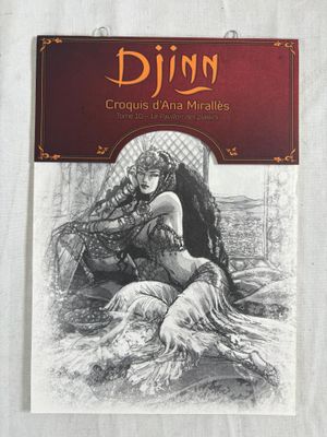 a book with a drawing of a woman sitting on top of a bed