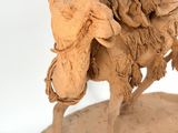 statue of a man riding a horse with a man on it