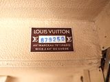 a close up of a louis vuitton luggage label on a suitcase
