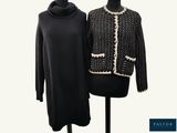 two black and white sweaters on a mannequin stand
