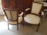 two chairs sitting next to each other in a room