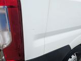 a white van parked on the side of the road