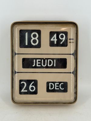 a clock that reads 18 49 and the date of the day
