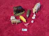 a lot of toy animals that are on a red carpet