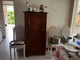 many plates and pans on the table in the kitchen