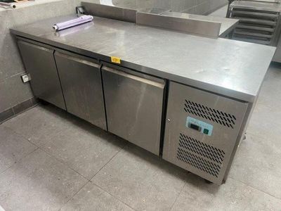 a stainless steel counter top in a commercial kitchen