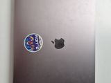 a laptop with a sticker on the back of it