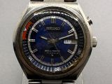 a close up of a wrist watch with a blue face