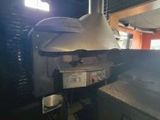 a large oven that is cooking food inside of a building