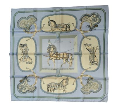 blue and yellow scarf with horses and carriages on it