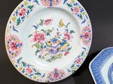 two plates that are sitting next to each other on a table