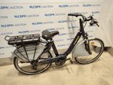 a bike that is parked in front of a wall