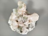 a close up of a piece of rock with a lot of crystals