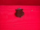 a small piece of chocolate sitting on top of a red cloth