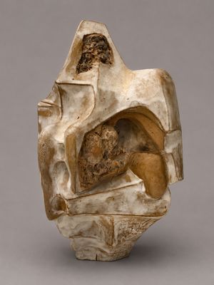 an image of a sculpture of a man sitting on top of a rock