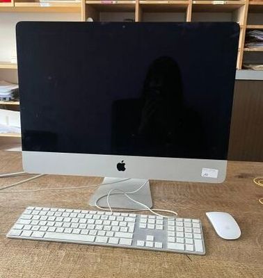 a computer on a table with a keyboard and mouse