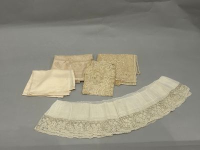 several pieces of lace are laid out on a gray surface