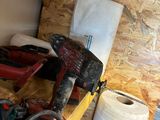 a pile of tools sitting on a table in a room