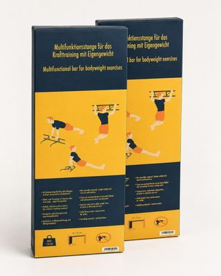 pair of two books on a white surface with a yellow background