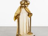 an image of a statue of a person wearing a crown and holding a cane