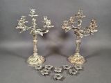 pair of silver plated candlesticks with flowers and leaves