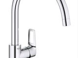 a close up of a kitchen sink faucet with a chrome finish