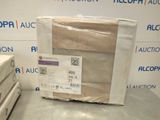 two boxes of bedding on a table in a room