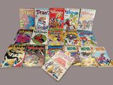 a lot of comic books that are on the table
