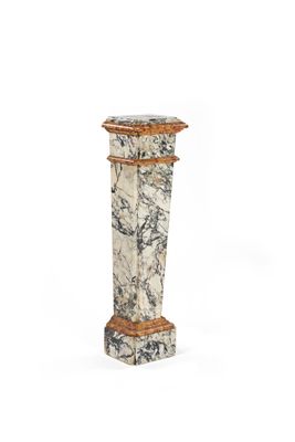 marble pedestal with a wooden base and a carved top