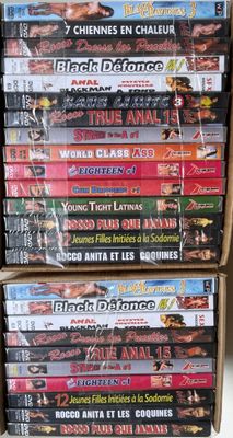 several dvds stacked on top of each other in a box