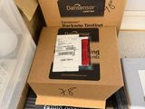 two boxes of electronic equipment sitting on the floor