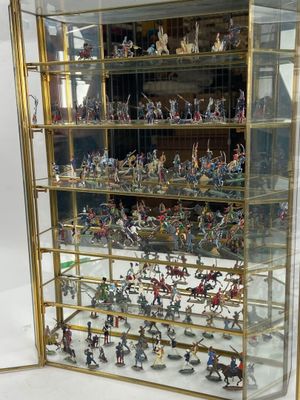 a display case with a lot of miniature figurines in it