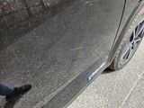 a close up of a car ' s tire on the street