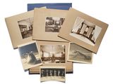 an old photo of a bunch of old photos on a table