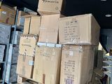 many boxes stacked on top of each other in a warehouse