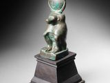 an image of a bronze statue of a child on a pedestal
