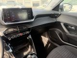 the interior of a car with a touch screen and steering controls
