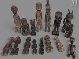 an image of a group of wooden figurines sitting on top of a table