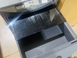 a small oven that is open on the floor